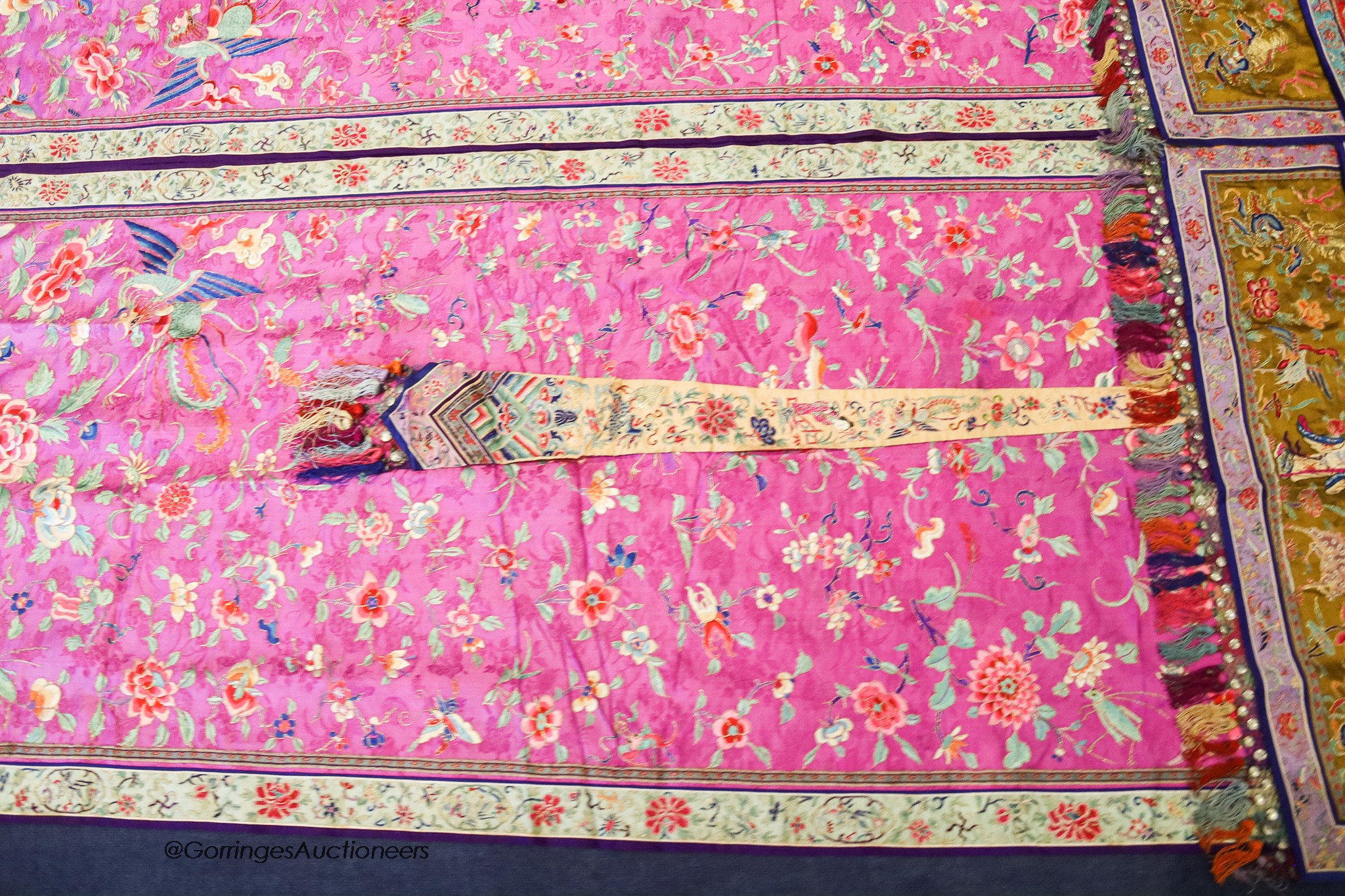 A pair of 20th century Chinese silk embroidered ceremonial panels, possibly for a wedding, 228cm not including fringing, each panel width 80cm, with a matching pelmet, width 198cm